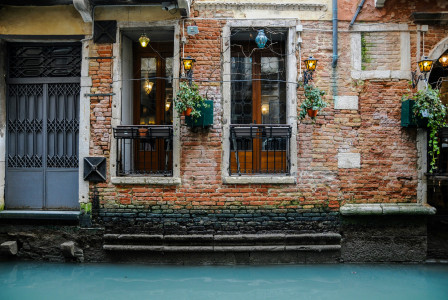 Photo by Unsplash An illustrative photo of a building with brown wooden door.