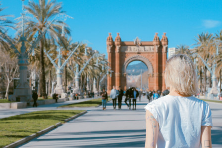 Photo by Unsplash An illustrative photo of a woman standing on road.