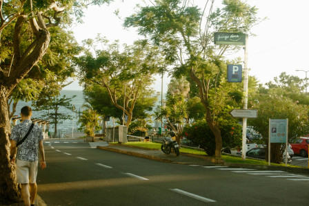An illustrative photo of a woman walking down a street.