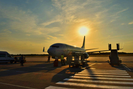 An illustrative photo of an airplane parked during daytime