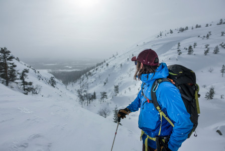 An illustrative photo of a person on skis on a snowy mountain