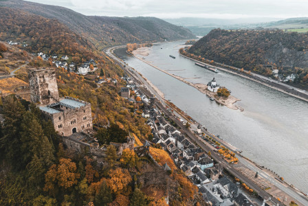 An illustrative photo of a river near a city on a hill