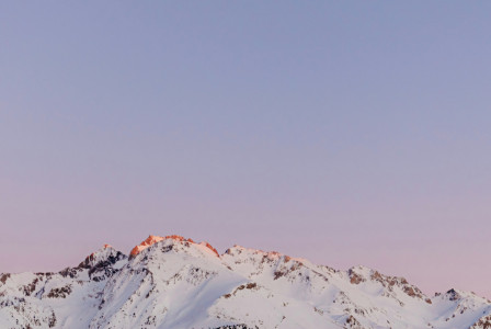 An illustrative photo of a mountain covered with snow