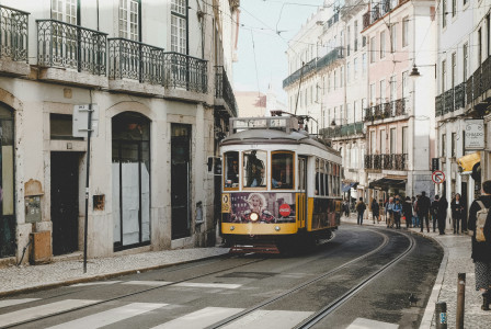An illustrative photo of a cable train in between high-rise building at daytime