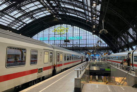 An illustrative photo of a train station with two trains parked next to each other