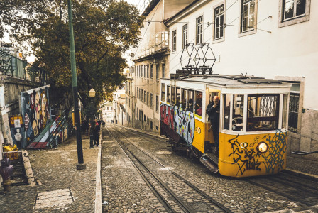 An illustrative photo of a tram on a railway road.