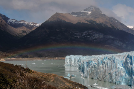 An illustrative photo of a body of water with ice near the mountain