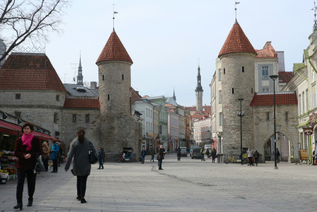An illustrative photo of people walking near old castles in Tallinn