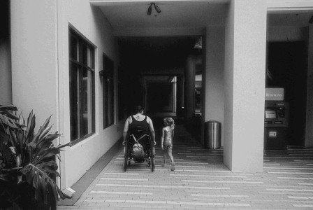 An illustrative photo of a man in a wheelchair.