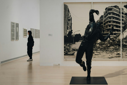 Image by Unsplash An illustrative photo of people standing in a gallery.