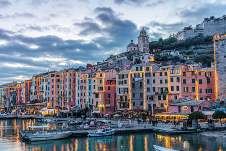 An illustrative photo of boats on water near buildings
