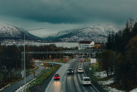 An illustrative photo of cars and mountains.