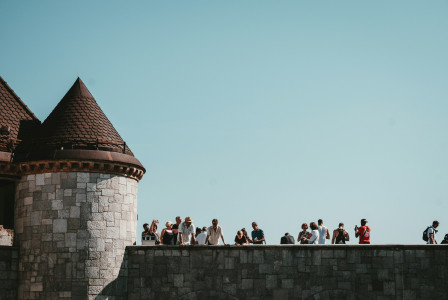 An illustrative photo of people on a tower.