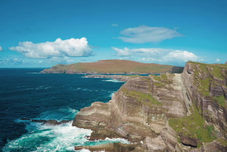 An illustrative photo of a rocky cliff near a body of water