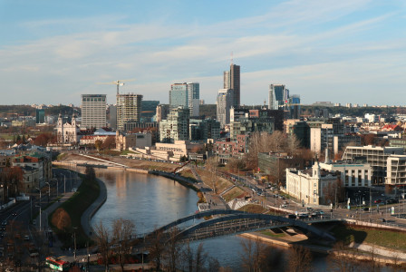 An illustrative photo of a river running through a city.
