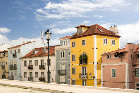 Image by Unsplash An illustrative photo of buildings of different colours.