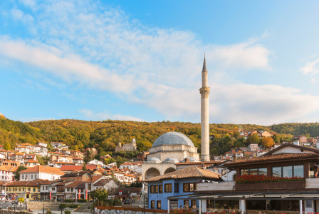 Image by Unsplash An illustrative photo of buildings with brown roofs under blue sky.