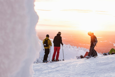 An illustrative photo of people skiing on a snow-covered mountain.