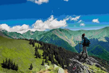 An illustrative photo of a man hiking in the mountains.