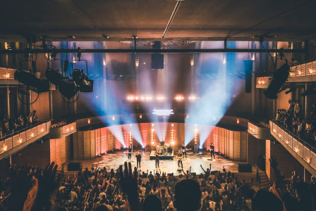 Photo by Unsplash An illustrative photo of people standing on stage.