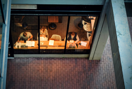 An illustrative photo of three persons sitting on chair.
