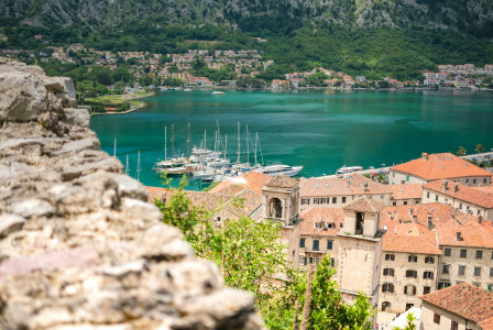 Image by Unsplash An illustrative photo of a lake surrounded by houses in the mountains.