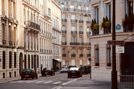 An illustrative photo of parked cars on a street in Paris.
