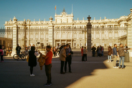 An illustrative photo of a group of people standing in front of a building.