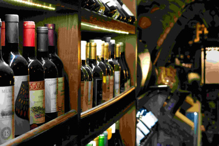 Photo by Unsplash An illustrative photo of bottles of wine on a shelf.