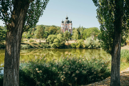 An illustrative photo of a church near a body of water.