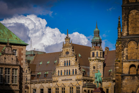 An illustrative photo of a large building with a clock tower on top of it.