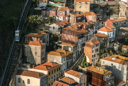 Photo by Unsplash An illustrative photo of white houses on a hill.