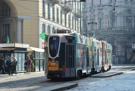 An illustrative photo of a tram on a city street.