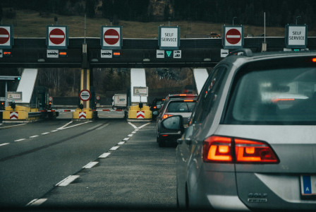 Photo by Unsplash An illustrative photo of a gray suv on the road during the day.