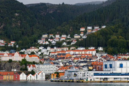 An illustrative photo of a view of a city from across the water.