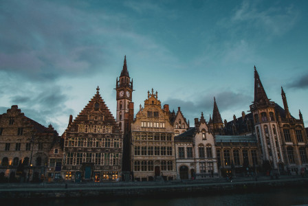 Photo by Unsplash An illustrative photo of brown buildings near a river.