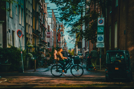 Photo by Unsplash An illustrative photo of a man riding a bike.