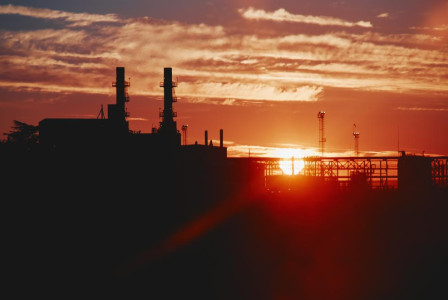 Sunset over industrial landscape