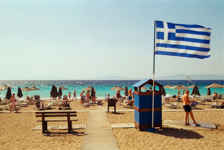 Photo by Unsplash An illustrative photo of a flag on a beach.