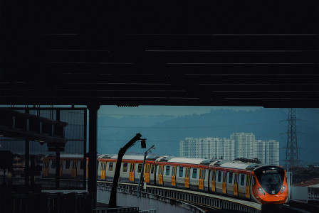 An illustrative photo of a train traveling down train tracks.