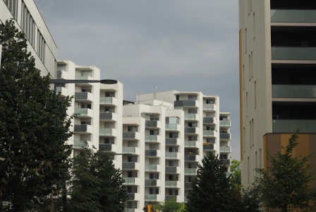 An illustrative photo of a couple of tall buildings.