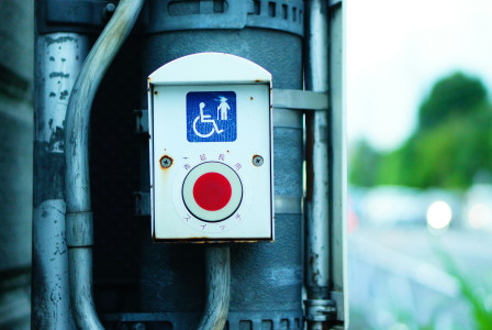 An illustrative photo of a button for road-crossing for people with disabilities.