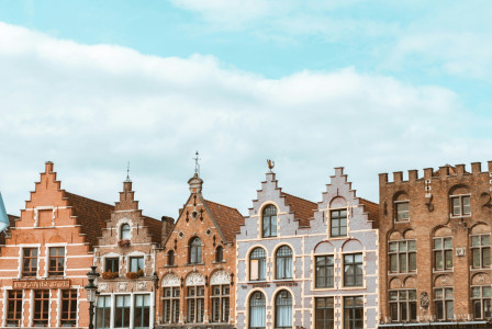An illustrative photo of beige concrete buildings.