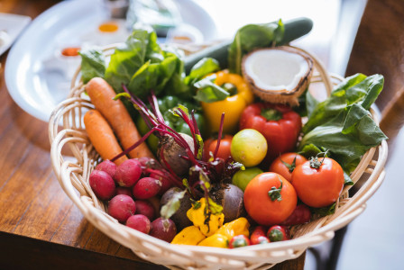An illustrative photo of fresh vegetables in a basket.