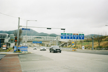Photo by Unsplash An illustrative photo of cars travel down a road.