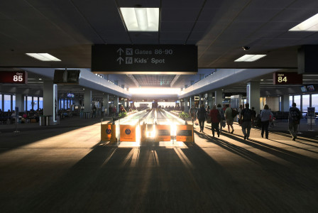 An illustrative photo of people walking on sidewalk.