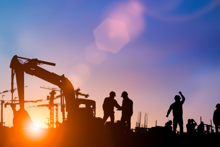 Engineer and construction team working at site