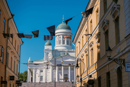 Photo by Unsplash A white concrete building in Helsinki under the blue sky in a daylight
