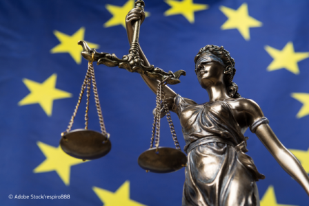 Justice statue in front of the European flag