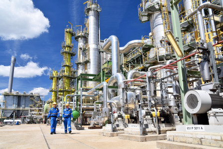 Workers in front of factory